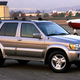 A champaign colored early-2000's Infiniti QX4.